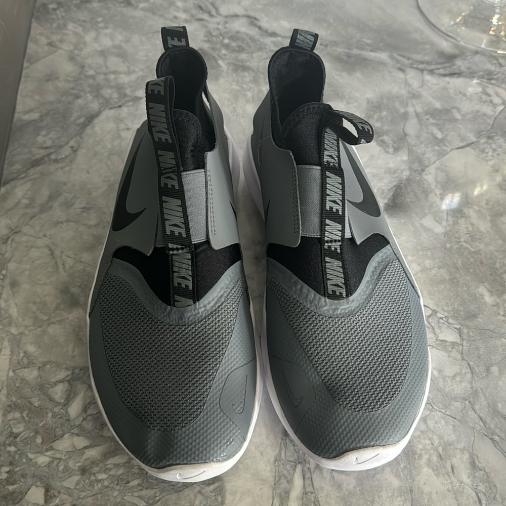 Kid’s Nike slip-on gym shoes. Children’s size 6